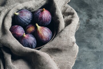 Fresh figs arrangement in bowl kitchen table food photography natural light close-up gourmet concept