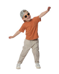Happy little boy with sunglasses dancing on white background