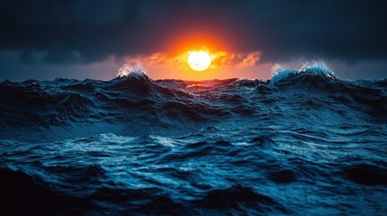 Dramatic sunset over a stormy sea.  Dark, turbulent waves crash against each other as a fiery orange sun sets, casting dramatic light on the water