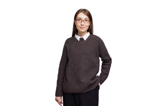 Confident young girl in a stylish sweater and glasses poses for a creative portrait against a clean, bright background