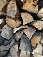 Fototapete Rund stack of firewood © Elena
