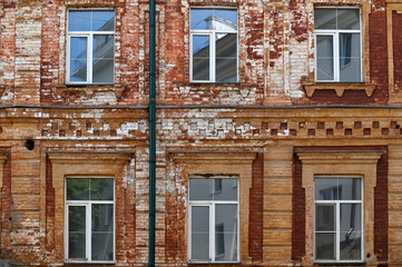 Fragment of old building with and windows