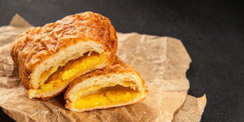 Triangle cake almond puff pastry sweet dessert fresh delicious gourmet food background on the table rustic food top view copy space