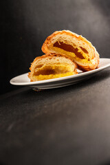 Triangle cake almond puff pastry sweet dessert fresh delicious gourmet food background on the table rustic food top view copy space