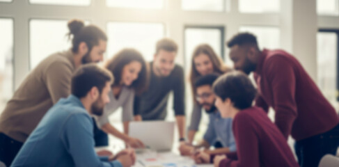 Diverse group of people collaborates around a laptop in a bright office.