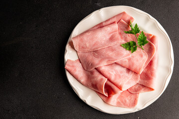 Ham slices meat spam pork fresh delicious gourmet food background on the table rustic food top view...