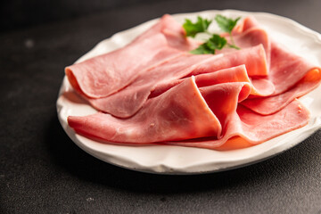 Ham slices meat spam pork fresh delicious gourmet food background on the table rustic food top view...