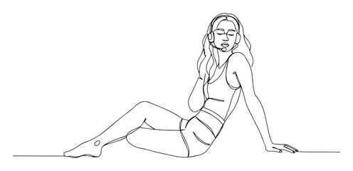 woman in swimsuit sitting on floor