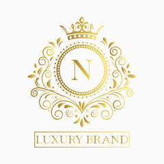 Luxurious and elegant logo design with a stylized letter N in gold featuring regal floral embellishments