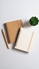 Minimalist top view of pastel beige eco-friendly notebooks and wooden pens