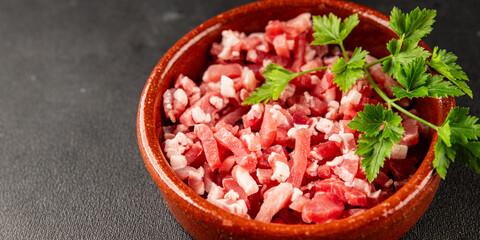Bacon cubes smoked chopped meat small pieces fresh delicious gourmet food background on table rustic food top view copy space