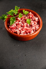 Bacon cubes smoked chopped meat small pieces fresh delicious gourmet food background on table rustic food top view copy space