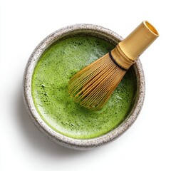 Top view of matcha tea bowl with bamboo whisk inside on pure white background for graphic use