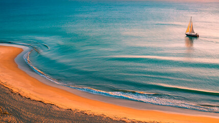 Golden Curve Aerial View of Crescent Shoreline at Sunset (1)
