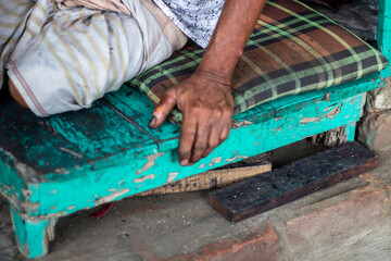 A cobblers sit down and hold dirty table