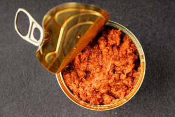 Tuna tomato sauce canned fish seafood fresh delicious gourmet food background on the table rustic food top view copy space keto and paleo diet vegan food pescetarian diet