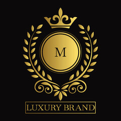 Gold Emblem with Crown and Laurel Wreath on M Logo Black Background