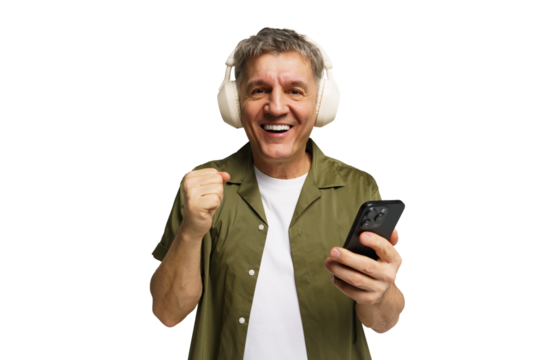 Joyful middle-aged man listening to music with headphones while smiling and holding a smartphone transparent background