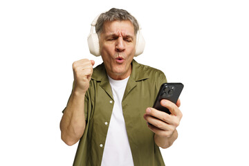 Joyful man celebrates a musical moment while listening to tunes on a smartphone in a bright,...
