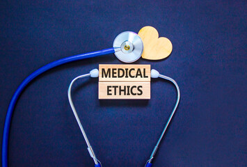 Medical ethics symbol. Concept words Medical ethics on beautiful wooden blocks. Wooden heart and...