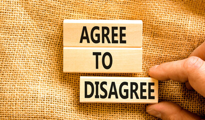 Agree to disagree symbol. Concept words Agree to disagree on beautiful wooden block. Businessman's...