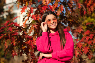 Teenager girl in the autumn park. Fall concept. Girl in autumn style outdoor. Fall style fashion....