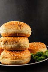 Bun burger puffy soft buns baking fresh delicious gourmet food background on the table rustic food...