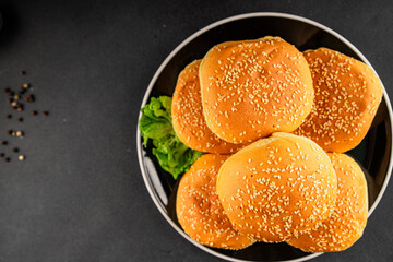 Bun burger puffy soft buns baking fresh delicious gourmet food background on the table rustic food top view copy space