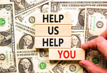 Help you symbol. Concept words phrase Help us help you on beautiful wooden blocks. Dollar bills....