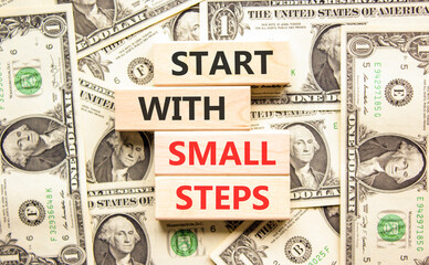 Start with small steps symbol. Concept words phrase Start with small steps on beautiful blocks....