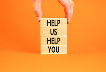 Help you symbol. Concept words phrase Help us help you on beautiful wooden blocks. Beautiful orange...