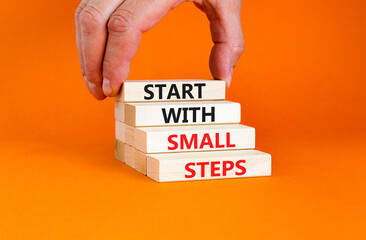 Start with small steps symbol. Concept words phrase Start with small steps on beautiful wooden...