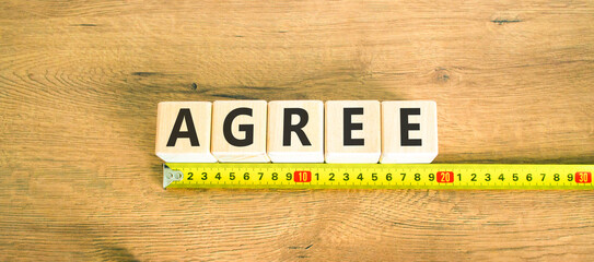 Agree symbol. Concept word Agree on beautiful wooden blocks. Beautiful wooden table wooden...