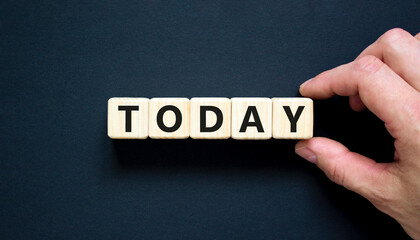 Today symbol. Concept word Today on beautiful wooden blocks. Beautiful black table black background. Businessman hand. Business lifestyle today concept. Copy space.