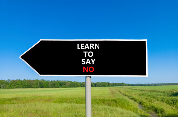 Learn to say no symbol. Concept words phrase Learn to say no on beautiful black road sign....