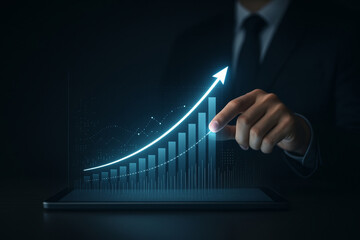 Businessman interacts with futuristic digital graph on tablet, showcasing glowing upward trend. dark background highlights bright data visualization, symbolizing growth and success