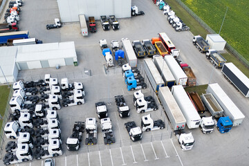 Parking of new and used trucks near the distribution and service center. Aerial view