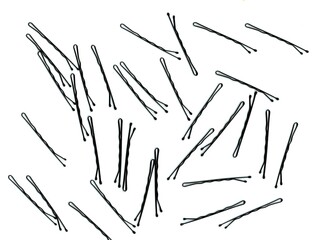 Black Hairpins on White – Isolated Scan. Flat lay scan of scattered hairpins on white background....