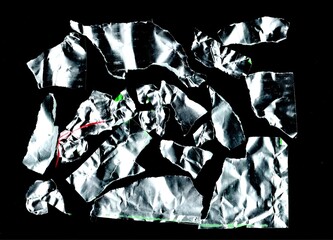 Crumpled Silver Foil – Abstract Scan. Scanned crumpled metallic foil with reflective highlights....