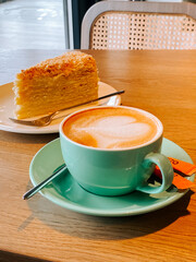 Coffee and cake served at a cozy cafe during a rainy afternoon