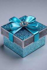 Teal gift box with silver accents and bow