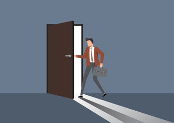 A businessman opening and stepping through a door with light shining through