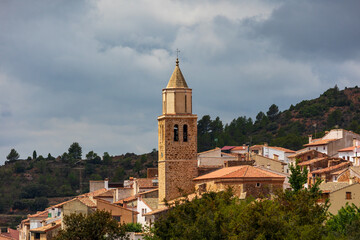 Obraz premium Horizontal view of the bell tower of the church of Cortes de Arenoso, Castellón, Spain.
