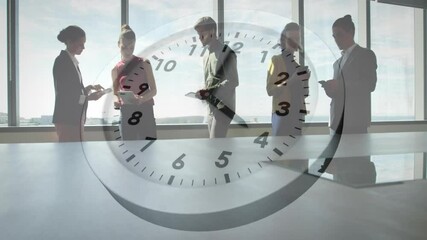 Man gesturing urging team tapping tablet collaborating in business while clock overlay marking time - Powered by Adobe