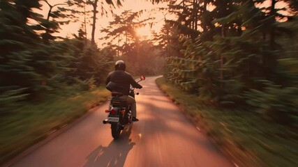 Aerial Sunset Shot of Biker Riding Royal Enfield in Forest