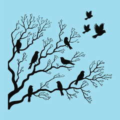 Obraz premium Black Birds Perched on Tree Branches Silhouetted Against Blue Sky
