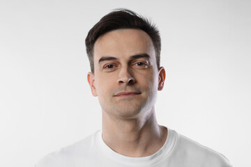 Obraz premium Portrait of handsome man on light background, closeup