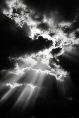 Dramatic black and white light rays breaking through clouds &ndash; spiritual contrast and divine symbolism