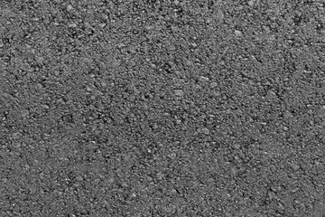 Black asphalt road texture background. Top view close-up. Copy space.