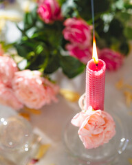 Beautiful pink and purple handmade beeswax candles. Candles for Love, femininity and sexuality.  Aromatherapy. Wax candles. Selective focus